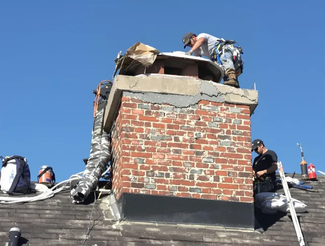 Port Orange Chimney Sweep installing a custom chimney crown in Port Orange, FL