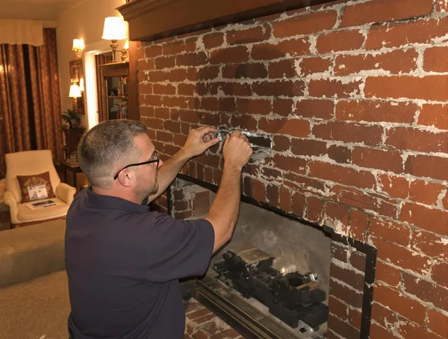 Port Orange Chimney Sweep expert fixing a fireplace in Port Orange, FL